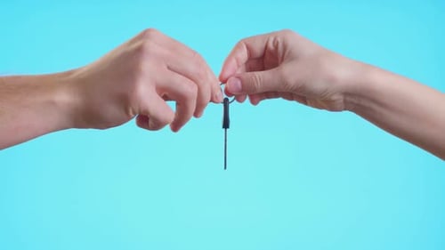 Hand Passes The Key Of The New Home To The Buyer