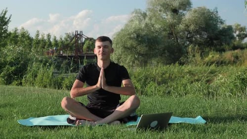 Young Adult Doing Yoga in Nature