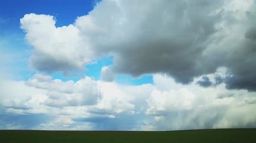 Dramatic Sky Before Rain With Rain Clouds On Horizon Above Rural Landscape Field Meadow
