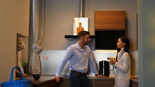 Adult Couple Conversing in Modern Kitchen