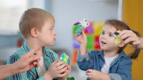 Children Playing Together with Building Toys at Home