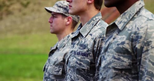 Air Force Service Members in Uniform Stand at Attention