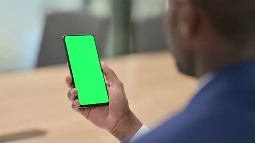 Smartphone with Green Screen Held Vertically