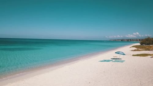 Umbrella In Caribbean Beach Of Paradise Blue
