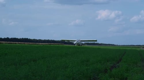 Lightweight Airplane Landing Airfield with Spinning Propeller Turning Off Engine