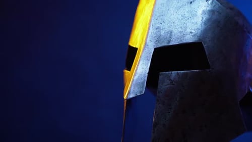 Weathered Spartan Helmet Under Dramatic Lighting