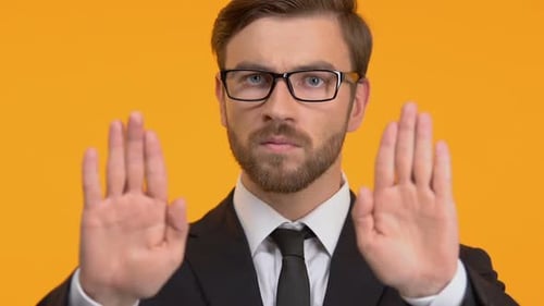 Confident Man Showing Stop Gesture, Refusal of Bribes, Honest Business, Close-Up