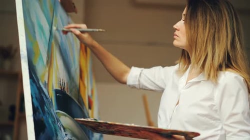 Woman Painting on Canvas in Art Studio