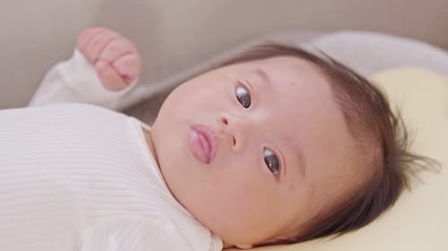Close Up of Adorable Infant Laying Awake