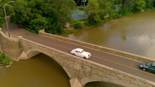 Old classic Rolls Royce car on a bridge