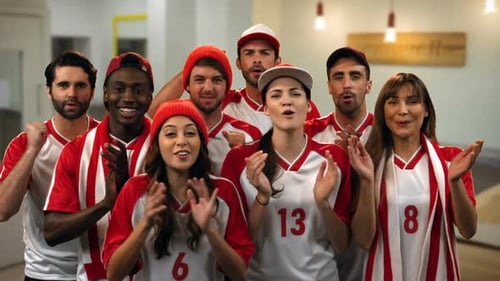 Excited Diverse Group of Sports Fans Cheering and Clapping