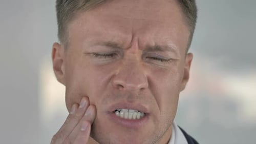 Toothache Close Up of Man with Tooth Infection
