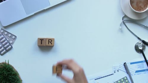 Treatment Word Composed by Lady Doctor of Wooden Cubes, Medical Care, Top View