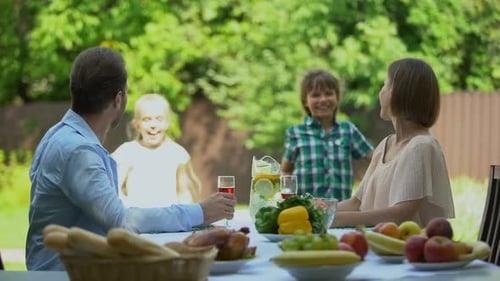Family Enjoys Lunch Together in the Garden