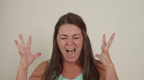 Angry Woman Yelling Loudly in a Close Up Shot