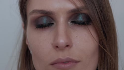 Woman's Face Close Up with Dramatic Eye Makeup