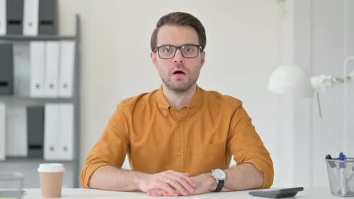 Man Reacting With Disappointment in the Workplace
