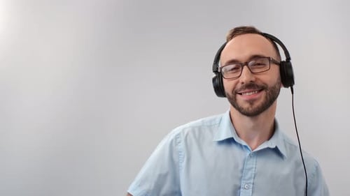 Young Adult Dancing with Headphones On