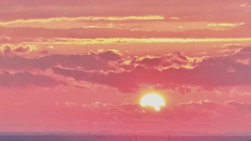 Majestic Sunrise with Pink and Orange Clouds