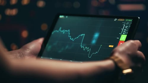 Stock Market Candles and Information of Exchange with Data of Price on the Tablet Screen