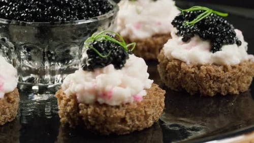 Caviar Appetizers on Black Serving Plate