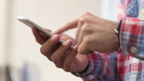 Person Using Smart Phone Technology Close Up