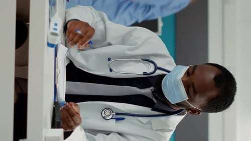 Doctor Explains Medication to Patient in Hospital