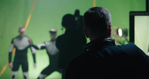 Film Crew and Actors on a Green Screen Set