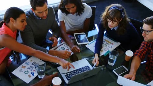 Diverse Young Adults Collaborating Around Table