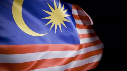 Malaysia Flag Waving on a Dark Background