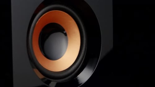 Vibrating Round Speaker on Black Background
