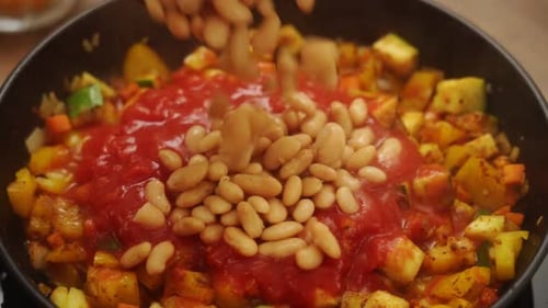 Adding White Beans to Vegetables with Tomato Sauce