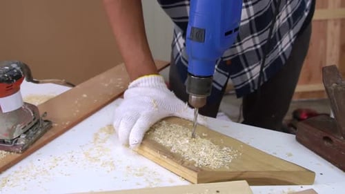 Carpenter Working on Wood Craft at Workshop