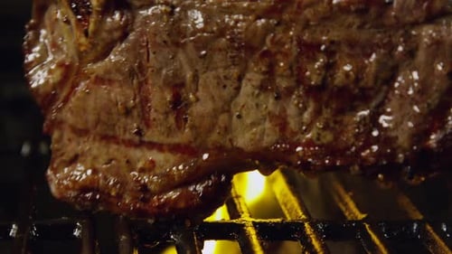Delicious T-Bone Steak On The Grill With Flames 42