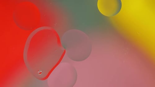 Vibrant Bubbles Floating in Colorful Liquid