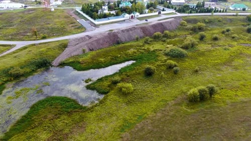 Quadcopter Flies Over the Field and the Monastery