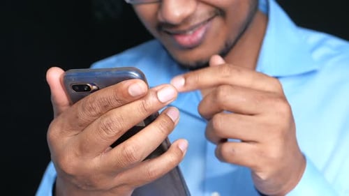 Happy Young Man Using Smart Phone.