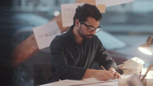 Architect Drawing Late at Night in Office