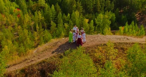 Aerial View People in Folk Costumes Lead a Round Dance Beautiful Outfits with Embroidery and Flower