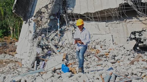Demolition control supervisor or engineer on demolish building.