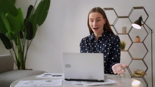 Excited Woman At Laptop Receives Shower of Money