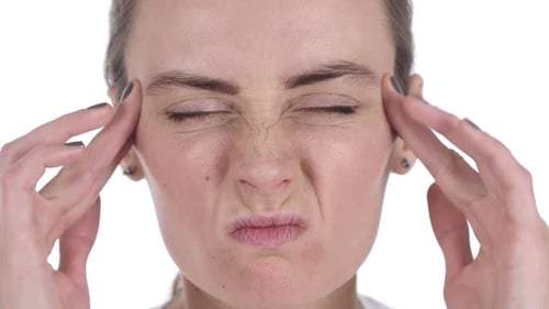 Close Up of Middle Aged WomanFace Gesturing Headache Stress