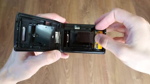 Loading Film Into Compact Film Camera