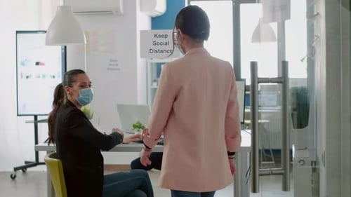 Business Colleagues Greeting Each Other with Elbow Bump