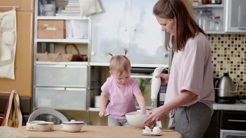 Mother and Child Baking Together in the Kitchen