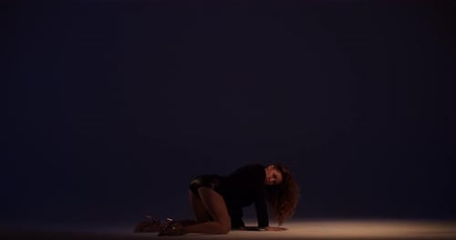 Young Female Dancer Is Performing at the Studio Dancing on the Floor