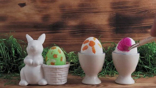 Painting an Easter Egg Pink in a Studio