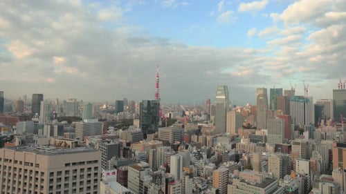Tokyo, Japan circa-2018. Time lapse shot of clouds moving over city of Tokyo and Tokyo Tower at sun