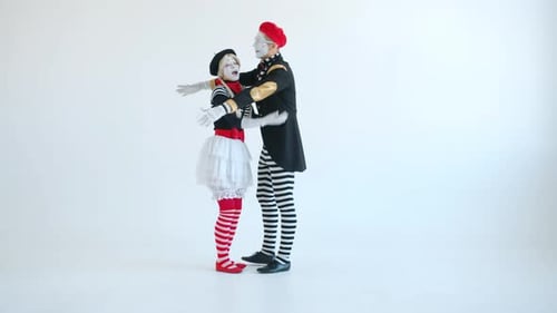 Mime Couple Embracing in White Studio