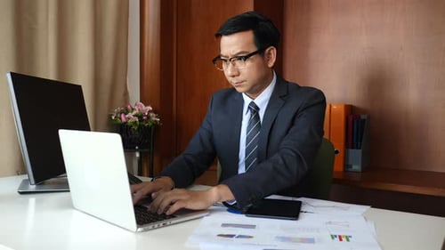 Businessman doing analysis planning business project in office.